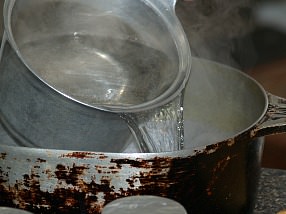 Pour Hot Water In Heavy Pan