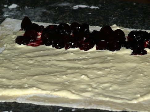 Cheese Spread on Puff Pastry with Row of Cherries