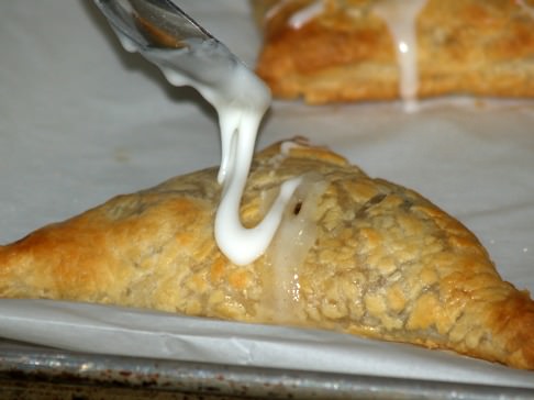 Placing Powdered Sugar Glaze on Warm Turnovers