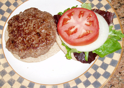 hamburger patty grilled and served on a bun