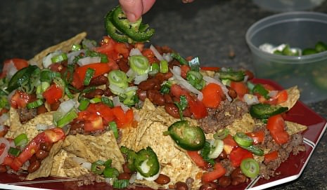 Sprinkle Jalapenos Over Nachos