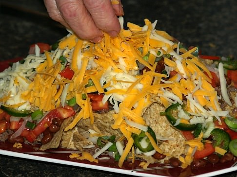 Sprinkle Cheese Over Nachos