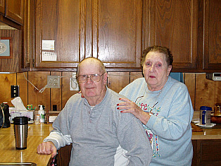 Larry and Pat at their farm where they are always cooking ribs