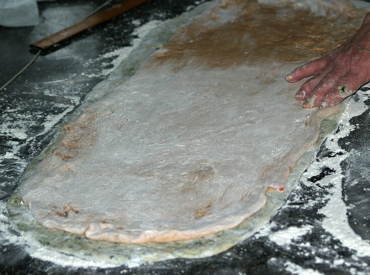 Roll Spinach dough in Rectangle then Roll Tomato Dough on Top