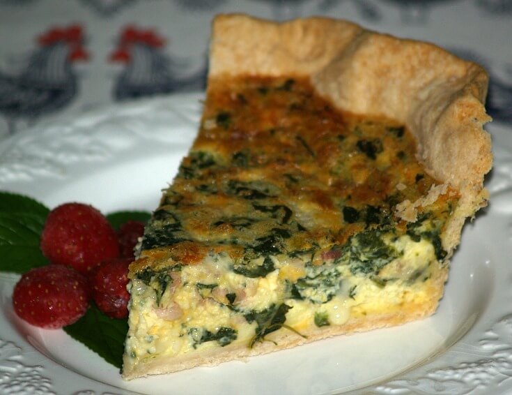 Cut Piece of a Bacon Spinach Quiche