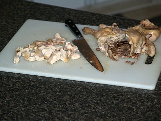 prepping chicken on a cutting board