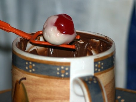 Dip Fondant Covered Cherry in Chocolate