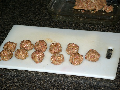ground chicken recipes like these meatballs ready to brown