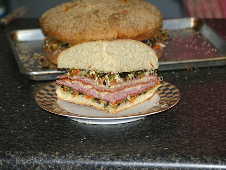 A quarter cut Muffaletta sandwich