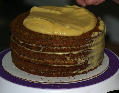 Putting Almond Filling Between Layers and Coating Top and Sides