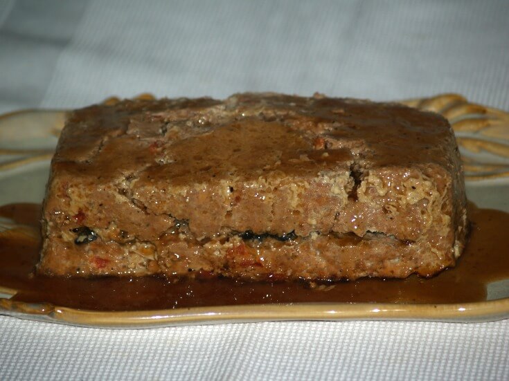 Mushroom Stuffed Meatloaf served with a Red Wine Sauce