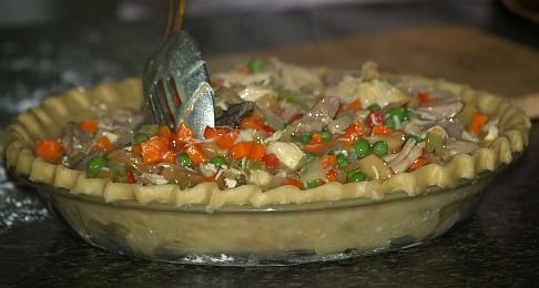 Putting the Filling in the Pie Crust for Turkey Pot Pie