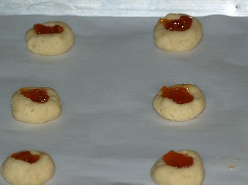 Unbaked Thumbprint Cookies Filled with Apricot